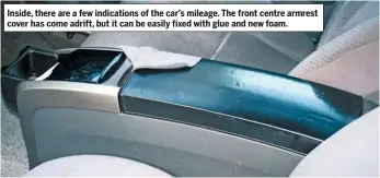  ??  ?? Inside, there are a few indication­s of the car’s mileage. The front centre armrest cover has come adrift, but it can be easily fixed with glue and new foam.