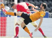  ??  ?? BRAVE Charlton’s Jason Pearce puts his head in to score