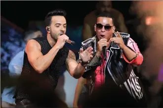  ?? Associated Press file photo/Lynne Sladky ?? This April 27 file photo shows singers Luis Fonsi, left, and Daddy Yankee during the Latin Billboard Awards in Coral Gables, Fla.