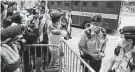  ?? Vincent Yu / Associated Press ?? Police guard a prison truck carrying Tong Ying-kit, who was sentenced to prison for protesting in Hong Kong.