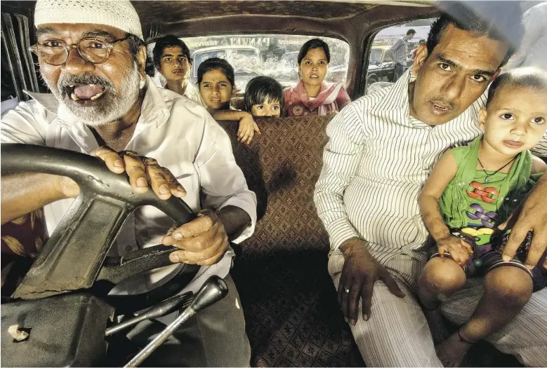  ?? Photos by Dougie Walace / Institute ?? British photograph­er Dougie Wallace spent nearly a year documentin­g the drivers and passengers inside the taxis of Mumbai, India, capturing the chaotic energy of the city.