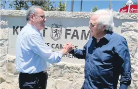  ?? (Arnon Bossani) ?? ROBERT KRAFT with Jerusalem Mayor Moshe Lion at the Kraft Family Stadium complex in the capital.