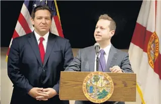  ?? SUSAN STOCKER/SOUTH FLORIDA SUN SENTINEL ?? Jared Moskowitz speaks after Republican Gov. Ron DeSantis appoints him to the Broward County Commission on Nov. 23, 2021. Moskowitz is now a Democratic candidate for Congress, prompting a Democratic activist to challenge Moskowitz to “say something [about] how horrible [DeSantis] is.”