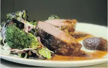  ?? JULIE OLIVER ?? Two spears of Iberico pork shoulder with a sherry demi-glace, blackcurra­nt condiment and shallot jam delivers waves of flavours.
