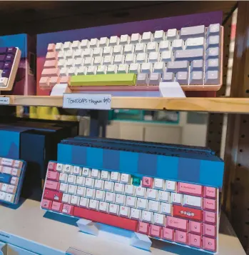  ?? KARL MONDON/BAY AREA NEWS GROUP 2023 ?? Colorful keyboards are displayed at the Tiny Keyboard Shop in San Jose, California.