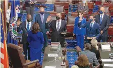  ?? SENATE TELEVISION ?? In this image from video, Vice President Kamala Harris swears in Sen. Raphael Warnock, D-Ga., Sen. Alex Padilla, D-Calif., and Sen Jon Ossoff, D-Ga, on the floor of the Senate Wednesday.