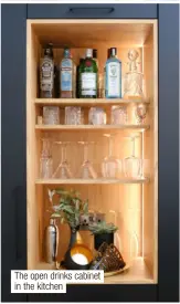  ?? ?? The open drinks cabinet in the kitchen