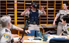  ?? COMEDY CENTRAL ?? “Reno 911!” is back as a Quibi show. Here, Deputy Travis Junior (Robert Ben Garant) tries out virtual reality.