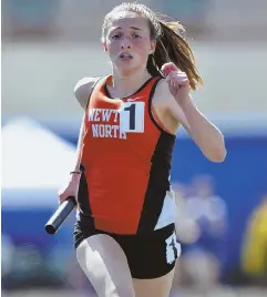  ?? HERALD PHOTOS BY JOSEPH PREZIOSO ?? GOOD DAY FOR A RUN: Newton North’s Catherine Degroot breaks a school record during the team’s win in the 4x1,600-meter relay, and Lowell’s Carlos Rivera (below) passes the baton to Joe Ben Jacob during their third-place finish in the 4x1,600 at...