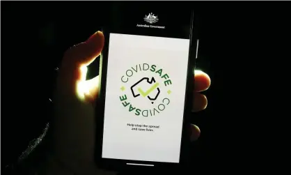  ?? Photograph: Dave Hunt/AAP ?? Over 7 million people in Australia have downloaded the Covidsafe app, but that metric doesn’t tell the full story of how and whether it is being used.