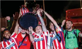  ?? Photograph: Pablo Garcia ?? Kieran Trippier (centre) won his first trophy after helping Atlético Madrid to secured the La Liga title last season.