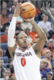  ?? [AP PHOTO] ?? The Thunder selected Virginia guard Devon Hall, left, with the 53rd pick Thursday.