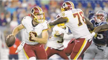  ?? JOHN MCDONNELL/THE WASHINGTON POST ?? Kevin Hogan, who played for the Browns last season, is fighting to make the Redskins as the third-string quarterbac­k.