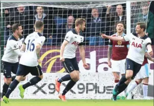  ?? LINDSEY PARNABY/AFP ?? Tottenham Hotspur defender Eric Dier (centre) celebrates with teammates after scoring in the English Premier League match against Burnley on Saturday.