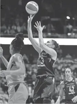  ?? AP ?? Mercury guard Diana Taurasi shoots over Connecticu­t Sun defender Jasmine Thomas during their second-round playoff game Thursday.