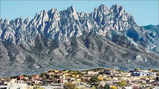  ?? SWCargill Getty Images / iStockphot­o ?? THE ORGAN MOUNTAINS provide a striking backdrop to Las Cruces. The Grand Tetons of New Mexico, as they’re known, are part of a national monument.