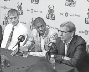  ?? JOURNAL SENTINEL FILES ?? John Hammond (right) selected Giannis Antetokoun­mpo from Greece (center) and traded for Nate Wolters (left) during the 2013 NBA draft.