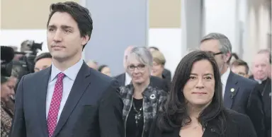  ??  ?? Prime Minister Justin Trudeau and then-Justice Minister Jody Wilson-Raybould take part in the grand entrance as the final report of the Truth and Reconcilia­tion Commission is released in December 2015 in Ottawa. Her departure from cabinet has left his reconcilia­tion agenda with Canada’s Indigenous Peoples in serious trouble.