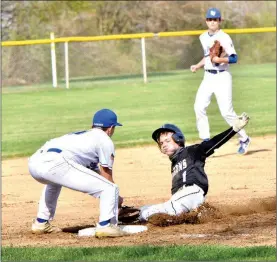  ?? PILOT PHOTO/RON HARAMIA ?? Laville’s Ayden Doyle puts the tag on Argos’ Jackson Kindig at third base during the Lancers’ home win Monday.