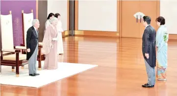  ?? — Reuters photo ?? Akihito and Empress Michiko receive a visit from Prime Minister Shinzo Abe and his wife Akie during a celebratio­n marking 60th anniversar­y of their wedding at the Imperial Palace in Tokyo.