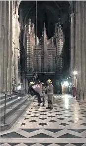  ??  ?? A trapdoor was opened in the cathedral ceiling so a specialist rope team could lower Ian Bowman 80ft from the bell tower to the marble floor. It was described as a “challengin­g job” by the Hereford and Worcesters­hire Fire and Rescue Service.