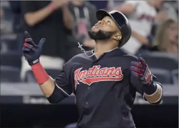  ?? BILL KOSTROUN — ASSOCIATED PRESS ?? The Indians’ Carlos Santana reacts as he crosses the plate after hitting a home run against the Yankees during the seventh inning Aug. 28 in New York.