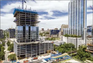  ?? JAY JANNER / AMERICAN-STATESMAN ?? The Independen­t started taking on elements of its “Jenga tower” look as constructi­on continued this week on the 58-story condo project, which will be the city’s tallest building.