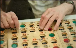  ??  ?? Terry Joseph of Lodi uses four wooden bingo boards made especially for him on Tuesday at the LOEL center.