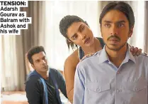  ??  ?? TENSION: Adarsh Gourav as Balram with Ashok and his wife