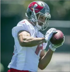  ?? LOREN ELLIOTT — TAMPA BAY TIMES VIA AP ?? Wide receiver Riley Cooper participat­es in drills during the Buccaneers’ rookie minicamp at the team’s practice facility in Tampa, Fla., Friday.