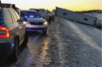  ?? JONAS ERLENDSSON/THE ASSOCIATED PRESS ?? A bus lies on its side after a collision that left 12 tourists critically injured and one dead in Iceland on Wednesday.