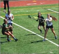  ?? Photo by Ernest A. Brown ?? Lincoln junior defender Aynur Esenova (16) attempts to pass the ball during Friday’s 15-10 Division II win over Chariho.