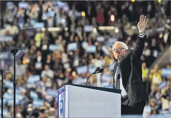  ?? Marcus Yam Los Angeles Times ?? DESPITE THEIR difference­s, Bernie Sanders said at the convention, “Hillary Clinton will make an outstandin­g president, and I am proud to stand with her tonight.”