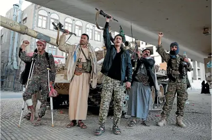  ?? PHOTO: AP ?? Houthi fighters chant slogans as they guard a street in Yemen’s capital, Sanaa, leading to the residence of former Yemeni president Ali Abdullah Saleh, a former Houthi ally who was killed after he switched sides in the country’s civil war.