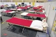  ?? AP PHOTO/MARCIO JOSE SANCHEZ, POOL ?? Cots are shown in a dormitory at an emergency shelter for migrant children Friday in Pomona, Calif.