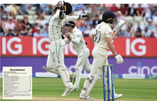  ?? Photo / AP ?? New Zealand wicketkeep­er Tom Blundell (left) celebrates the dismissal of England’s Ollie Pope (right, walking off the wicket) at Edgbaston.