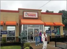  ?? RECORD FILE PHOTO ?? Investigat­or Zachary Sharpe of the Rensselaer County Sheriff’s Office uses a bullhorn to urge customers at the Dunkin’ Donuts in Brunswick to donate to the 2017 Cop on Top fundraiser for Special Olympics New York.