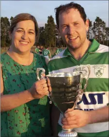  ??  ?? Aoife O’Connor, County Board Assistant Secretary and Shamrocks Secretary, presenting the trophy to her clubmate, Harry Goff.