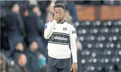  ?? JOHN WALTON THE ASSOCIATED PRESS ?? Fulham’s Ryan Sessegnon can’t believe his squad just lost 2-1 to fourth-tier Oldham in FA Cup play Sunday at Craven Cottage.