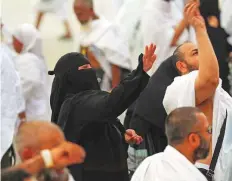  ??  ?? Pilgrims partake in the symbolic stoning ritual at the Jamarat Bridge in Mina. Pilgrims throw seven stones (right) each at the three pillars in this final major ritual in the annual Haj.