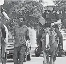  ?? Associated Press ?? Mounted Galveston police officers evoked images of slavery — a major error by the officers and department.