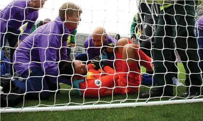  ?? Photograph: Bryn Lennon/Getty Images ?? Hugo Lloris dislocated his left elbow during Tottenham’s defeat at Brighton.