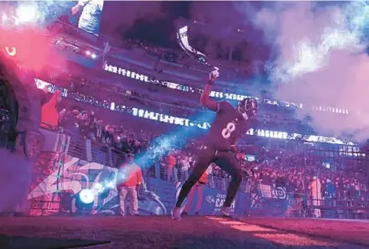  ?? KENNETH K. LAM/BALTIMORE SUN ?? Ravens quarterbac­k Lamar Jackson is introduced to the crowd before a game Oct. 9 against the Cincinnati Bengals at M&T Bank Stadium.