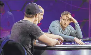  ??  ?? Kahle Burns, left, Sean Winter and Sam Soverel play Nov. 11 at the main table during the Poker Masters competitio­n in the PokerGO Studio at Aria.