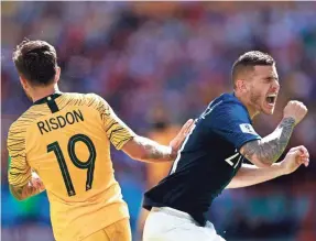  ?? BENJAMIN CREMEL/AFP/GETTY IMAGES ?? France defender Lucas Hernandez reacts as he’s touched by Australia’s Joshua Risdon in a game last week.