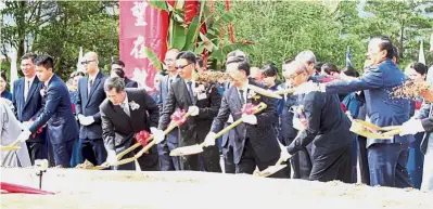  ??  ?? Chong (second from left) leading the ground-breaking ceremony of the school. Inculcatin­g good humanistic values: