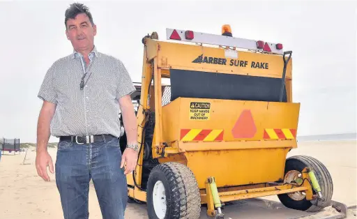  ??  ?? Pat Evans, Coney beach funfair owner, Porthcawl, and his new beach cleaning machinery and tractor