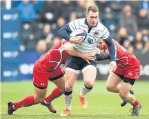  ??  ?? ■ Stuart Hogg drives forward for Scotland.