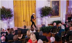  ?? Photograph: Nathan Howard/Getty Images ?? Jill and Joe Biden in the front row watch Brad Paisley perform at the White House in February.