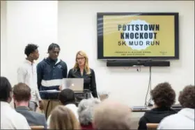  ?? SUBMITTED PHOTO ?? Pottstown High School innovators Jaheim Gregory and Wilchon Seward are joined by Twila Fisher in making their ‘Shark Tank’ presentati­on for the Pottstown Area Social Innovation­s Lab.